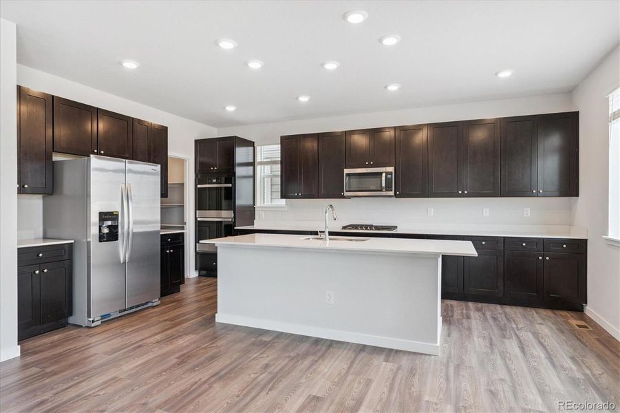 Furnished interior view inside a new home in Floret Collection at Alder Creek, Parker (Image 8).