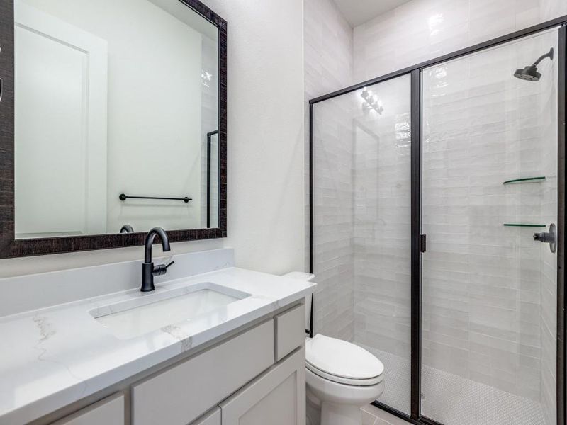 Friends and family will feel right at home in any of the beautifully finished guest baths.