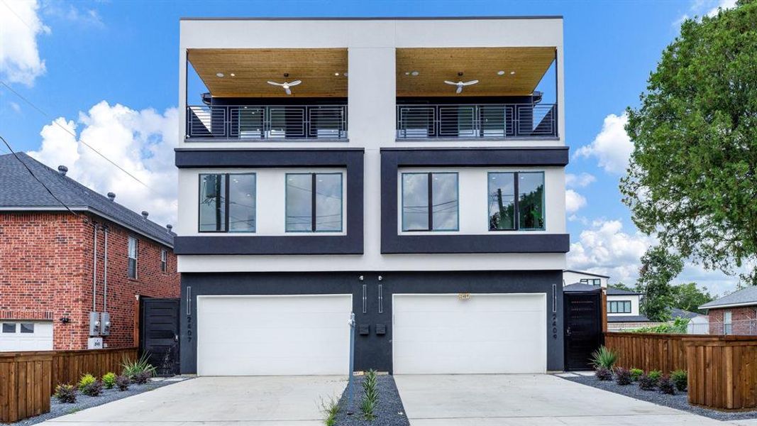 Contemporary home with a garage and a balcony