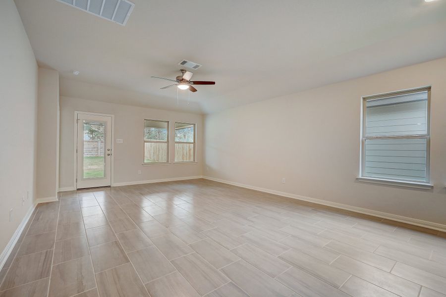 Dining room and living room in the Oleander floorplan at a Meritage Homes community.