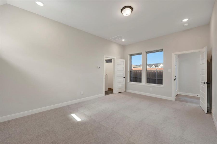 Unfurnished room featuring light carpet and recessed lighting