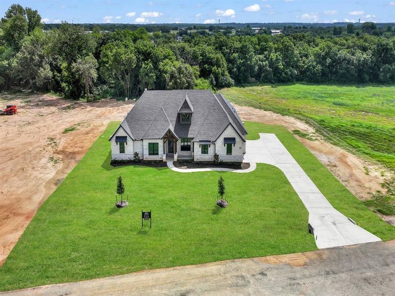 Front exterior of a new home in , Weatherford, TX, highlighting curb appeal (Image 26).