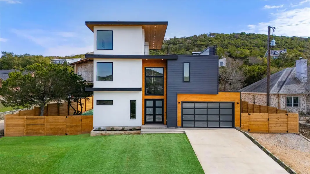 Front exterior of a new home in , Leander, TX, highlighting curb appeal (Image 1). Front exterior of a new home in , Leander, TX, highlighting curb appeal (Image 1).