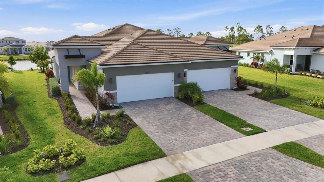Front exterior of a new home in , Venice, FL, highlighting curb appeal (Image 1). Front exterior of a new home in , Venice, FL, highlighting curb appeal (Image 1).