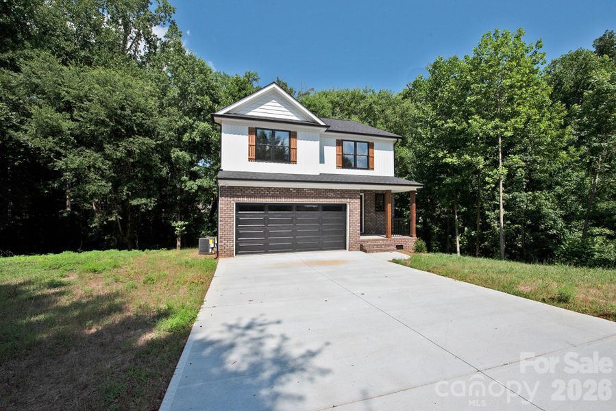 Front exterior of a new home in , Kannapolis, NC, highlighting curb appeal (Image 20). Front exterior of a new home in , Kannapolis, NC, highlighting curb appeal (Image 20).