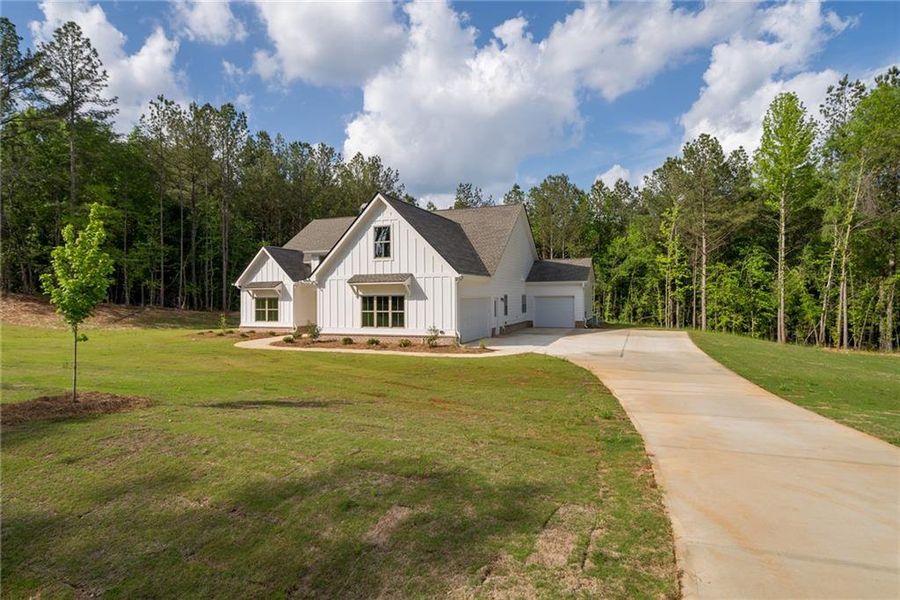 Front exterior of a new home in , Social Circle, GA, highlighting curb appeal (Image 21). Front exterior of a new home in , Social Circle, GA, highlighting curb appeal (Image 21).