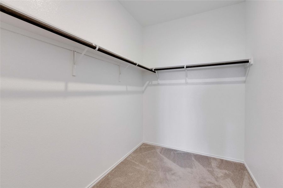 Spacious closet in primary bedroom. Spacious closet in primary bedroom.
