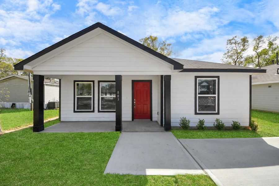Front exterior of a new home in , Cleveland, TX, highlighting curb appeal (Image 2).