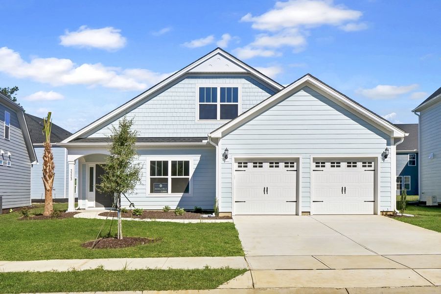 Front exterior of a new home in Grand Park, Leland, NC, highlighting curb appeal (Image 1).