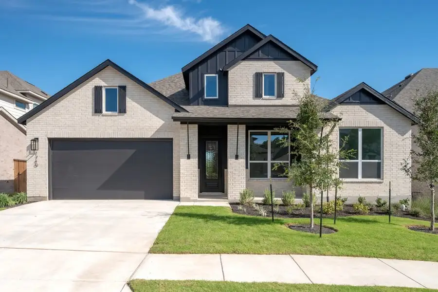 Front exterior of a new home in Parkside On The River, Georgetown, TX, highlighting curb appeal (Image 1). Front exterior of a new home in Parkside On The River, Georgetown, TX, highlighting curb appeal (Image 1).