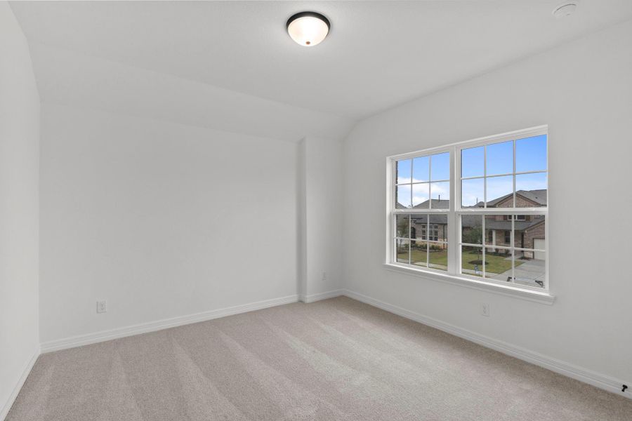 Your secondary bedroom features plush carpet, fresh paint, closet, and a large window that lets in plenty of natural lighting.