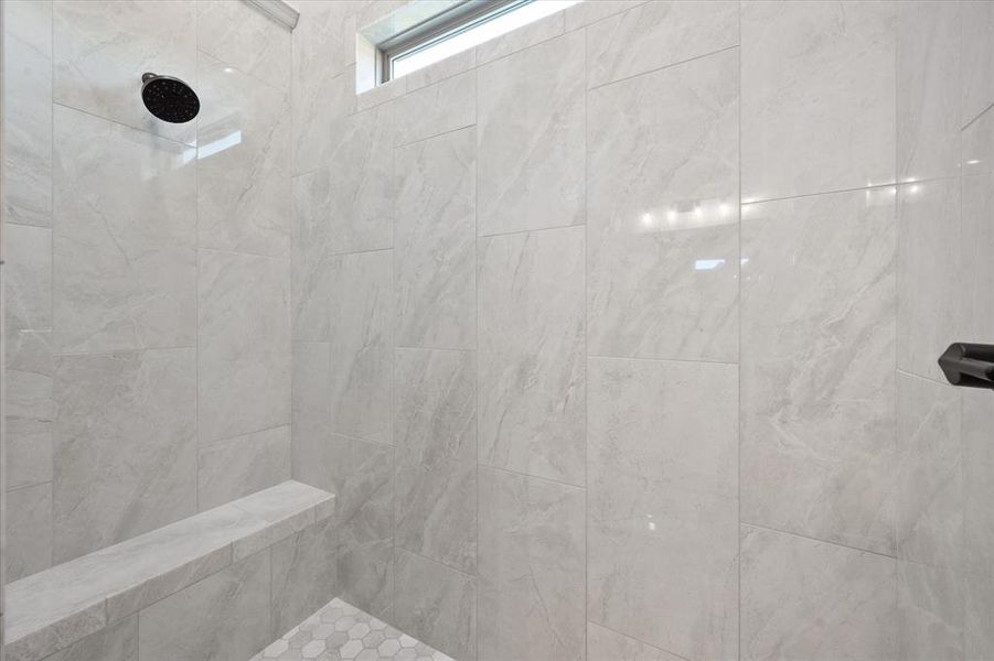 Bathroom with a tile shower