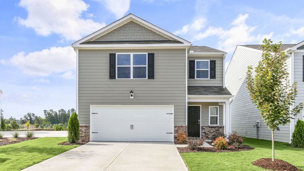 Front exterior of a new home in Belle Grove, Wendell, NC, highlighting curb appeal (Image 1). Front exterior of a new home in Belle Grove, Wendell, NC, highlighting curb appeal (Image 1).