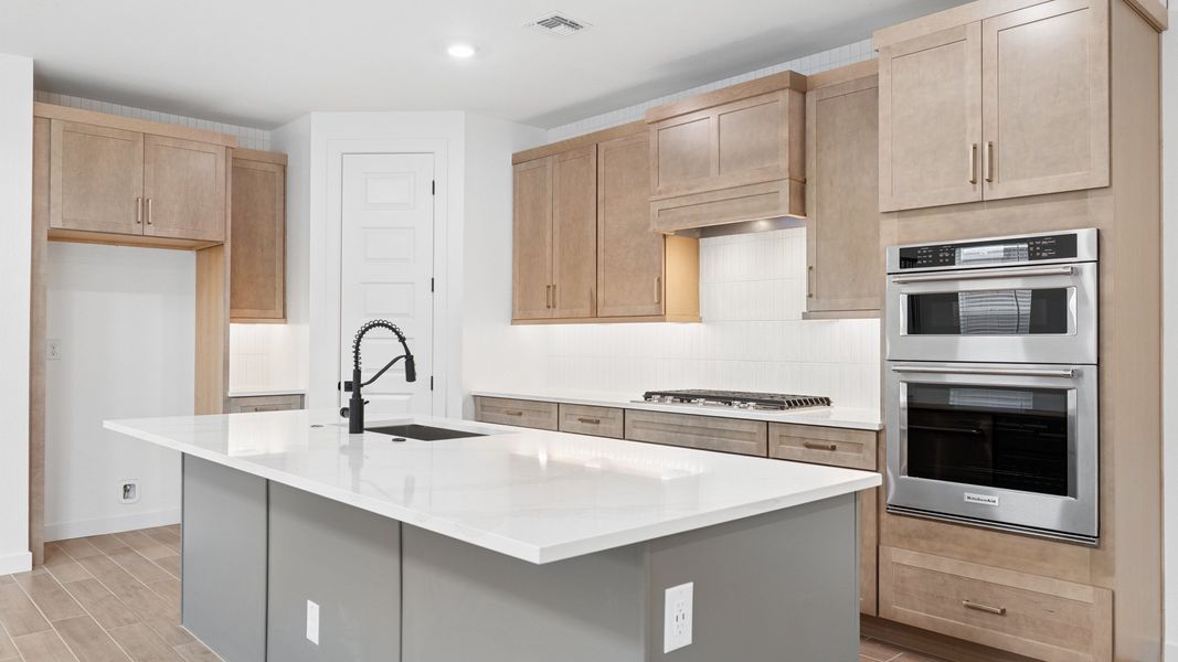 Representative furnished interior of a home built from the Phoenician by D.R. Horton in The Ridge at Stone Butte, Phoenix (Image 9).