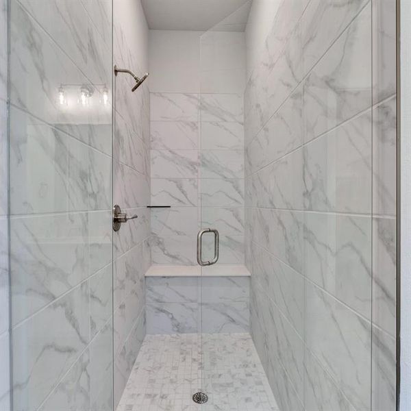 Bathroom with a shower with shower door