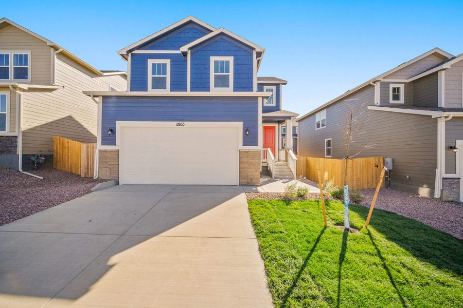 Front exterior of a new home in Ridge at Lorson Ranch, Colorado Springs, CO, highlighting curb appeal (Image 17).