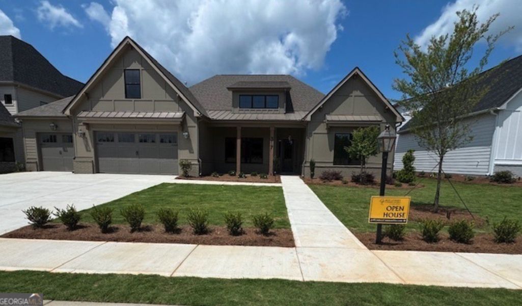 Front exterior of a new home in Mill Farms, Peachtree City, GA, highlighting curb appeal (Image 1).
