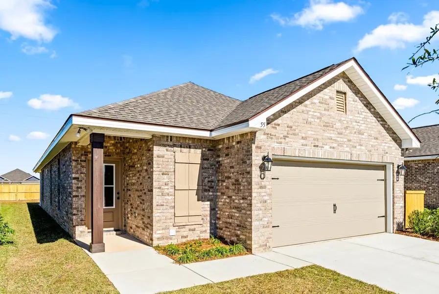 Front exterior of a new home in Natureview, Freeport, FL, highlighting curb appeal (Image 1). Front exterior of a new home in Natureview, Freeport, FL, highlighting curb appeal (Image 1).