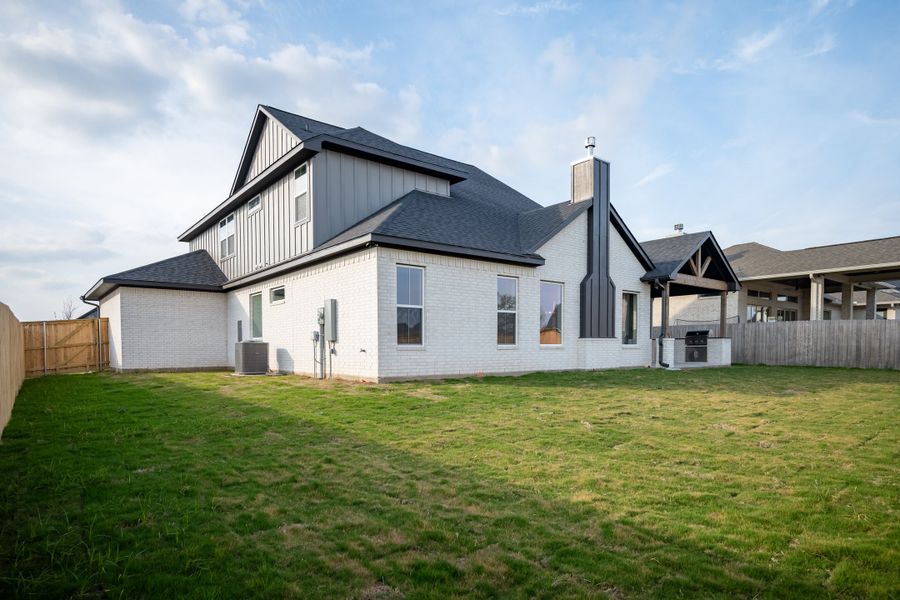 Exterior details and patio area of a home in Greens Prairie Reserve, College Station (Image 33).