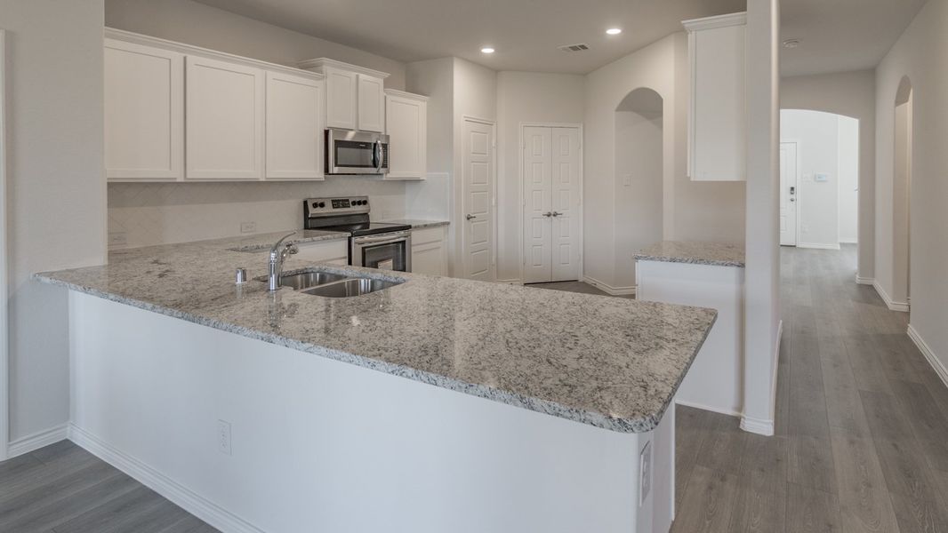Representative furnished interior of a home built from the Medbourne by D.R. Horton in Woodcreek, Fate (Image 4).