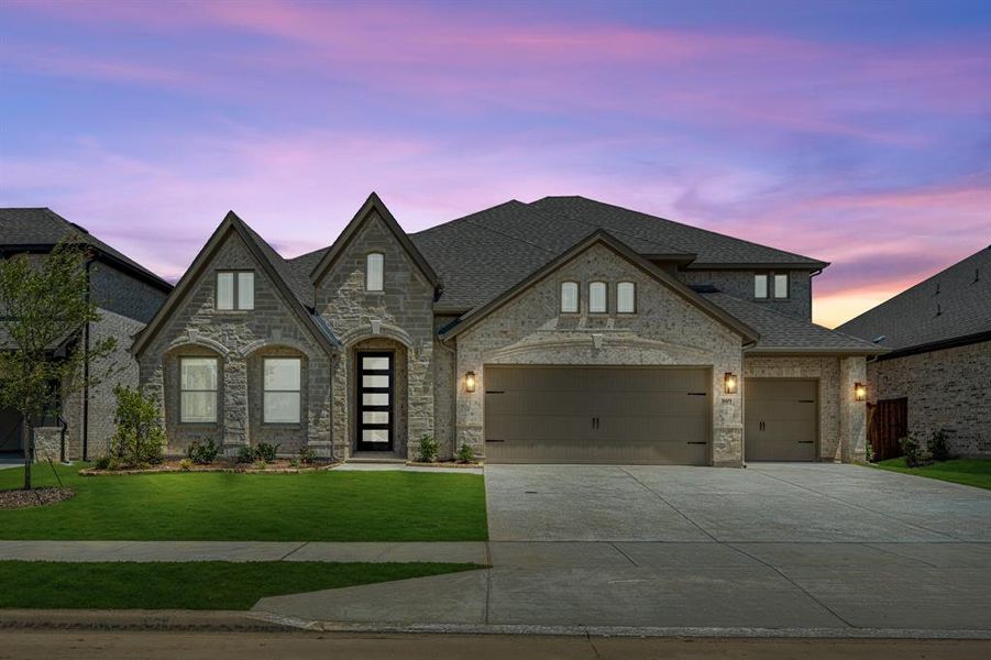 Front exterior of a new home in Wildflower Ranch 60-65, Justin, TX, highlighting curb appeal (Image 21). Front exterior of a new home in Wildflower Ranch 60-65, Justin, TX, highlighting curb appeal (Image 21).