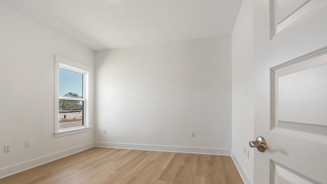 Representative unfurnished interior of a home built from the Camellia by D.R. Horton in Breakfast Point East Phase II, Panama City Beach (Image 26).