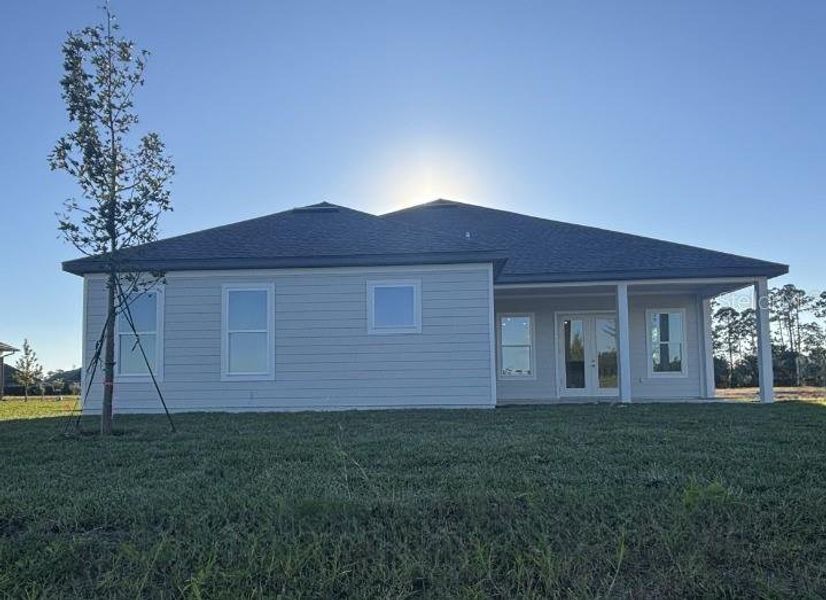 Exterior details and patio area of a home in Ardisia Park Estate, New Smyrna Beach (Image 27).