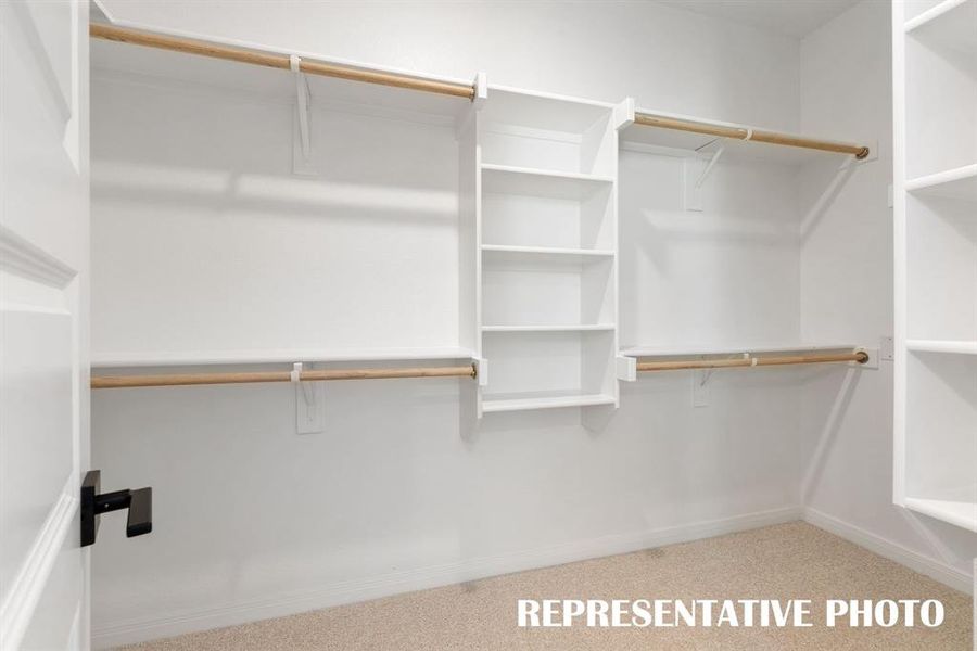 With built in shelving and tons of hanging space, your dream closet awaits!  REPRESENTATIVE PHOTO