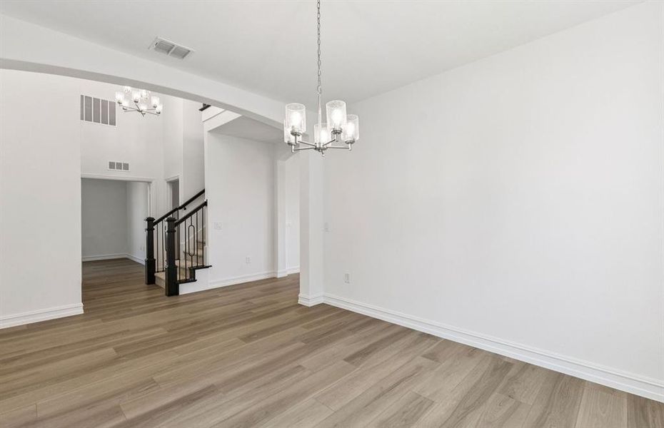Formal dining room with large windows