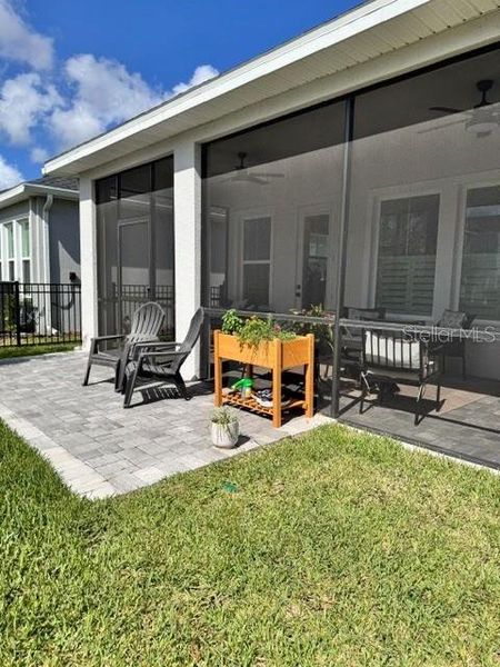 Exterior details and patio area of a home in Emerald Landing at Waterside at Lakewood Ranch – Lake Series, Sarasota (Image 3).