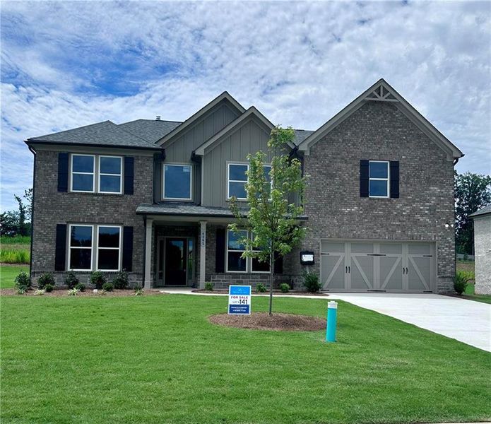 Front exterior of a new home in , Cumming, GA, highlighting curb appeal (Image 1). Front exterior of a new home in , Cumming, GA, highlighting curb appeal (Image 1).