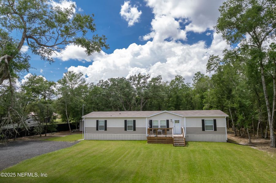 Front exterior of a new home in , Pomona Park, FL, highlighting curb appeal (Image 2).