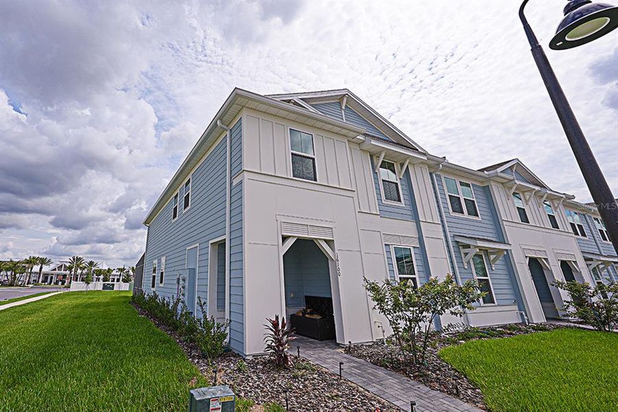 Front exterior of a new home in , Clermont, FL, highlighting curb appeal (Image 25).