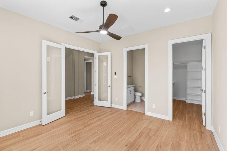 Second angle showcases the room’s spacious layout and access to the attached bath, perfect for comfort and privacy.