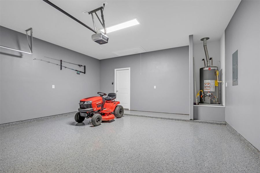Garage with epoxy floors and painted walls for your favorite toys.