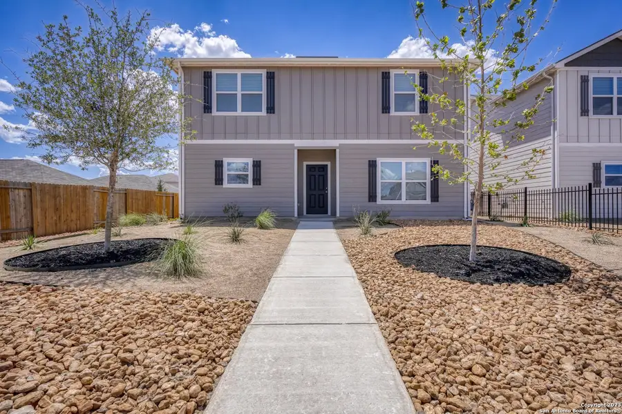 Front exterior of a new home in Luckey Ranch, San Antonio, TX, highlighting curb appeal (Image 2).