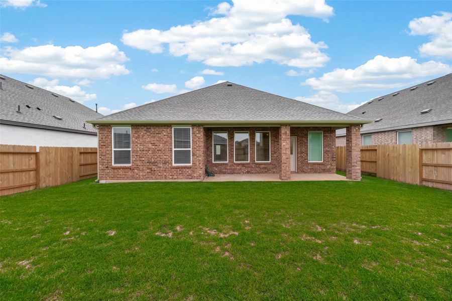 Exterior details and patio area of a home in Sunterra, Katy (Image 22).