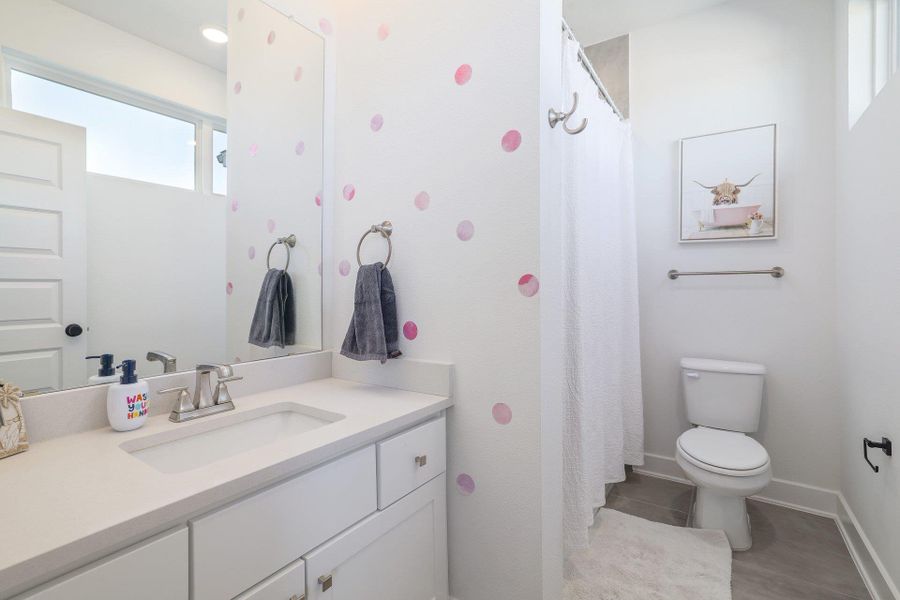 Designer-selected finishes and clean lines define this beautifully appointed bathroom.