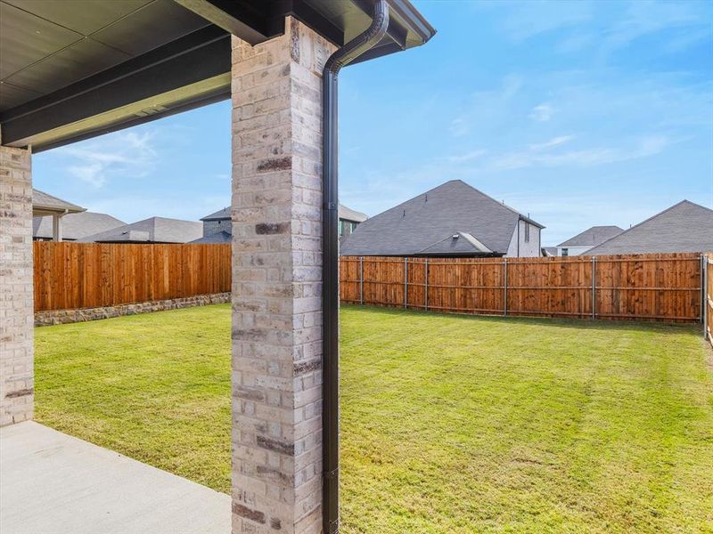 Exterior details and patio area of a home in Simpson Crossing - Spring Series, McKinney (Image 3).