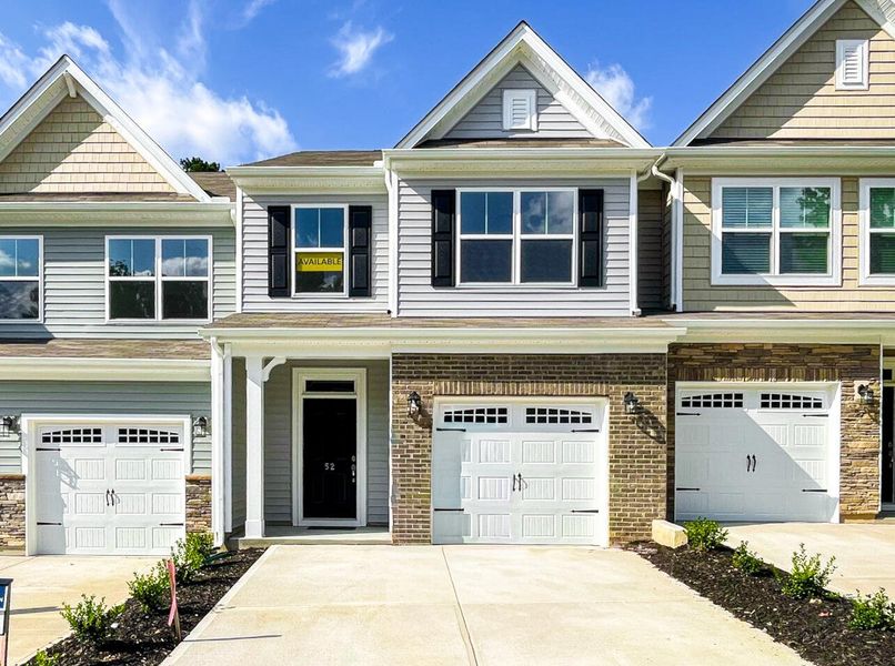Front exterior of a new home in Fairview Village Townhomes, Simpsonville, SC, highlighting curb appeal (Image 1). Front exterior of a new home in Fairview Village Townhomes, Simpsonville, SC, highlighting curb appeal (Image 1).