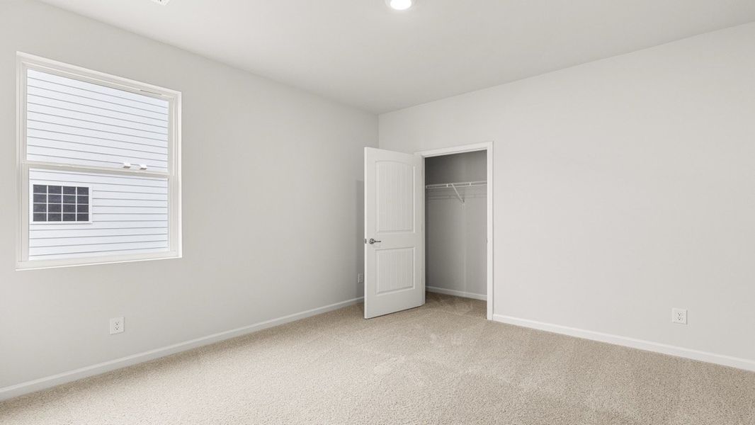 Representative unfurnished interior of a home built from the Booth by D.R. Horton in Liberty Crossing, Braselton (Image 27).