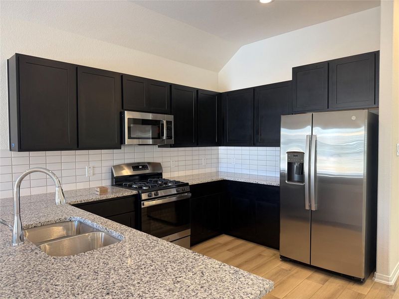 Furnished interior view inside a new home in East Gate Villas, Willis (Image 5).
