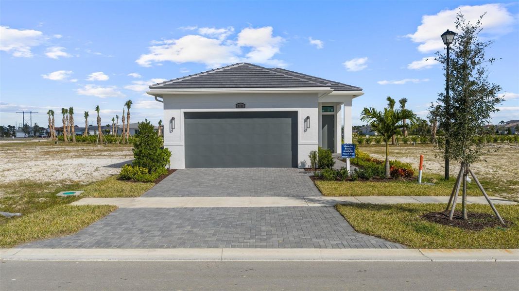 Front exterior of a new home in , Port St. Lucie, FL, highlighting curb appeal (Image 21).