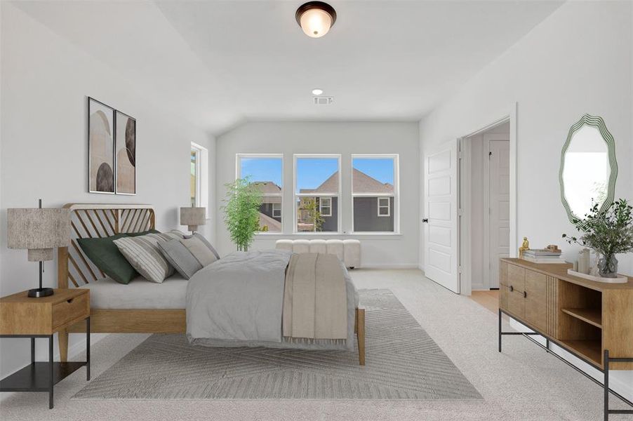 Spacious room featuring light-colored carpeting, white walls, and a ceiling light fixture