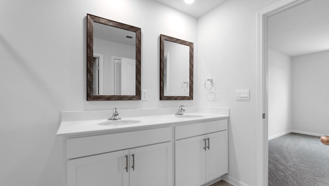 Furnished interior in a model home at Benjamin's Grove in Woodruff (Image 14).