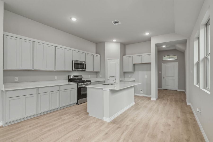 Kitchen in the Cedar home plan by Trophy Signature Homes – REPRESENTATIVE PHOTO Kitchen in the Cedar home plan by Trophy Signature Homes – REPRESENTATIVE PHOTO