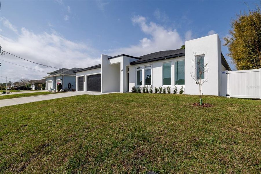 Front exterior of a new home in , Palm Coast, FL, highlighting curb appeal (Image 23).
