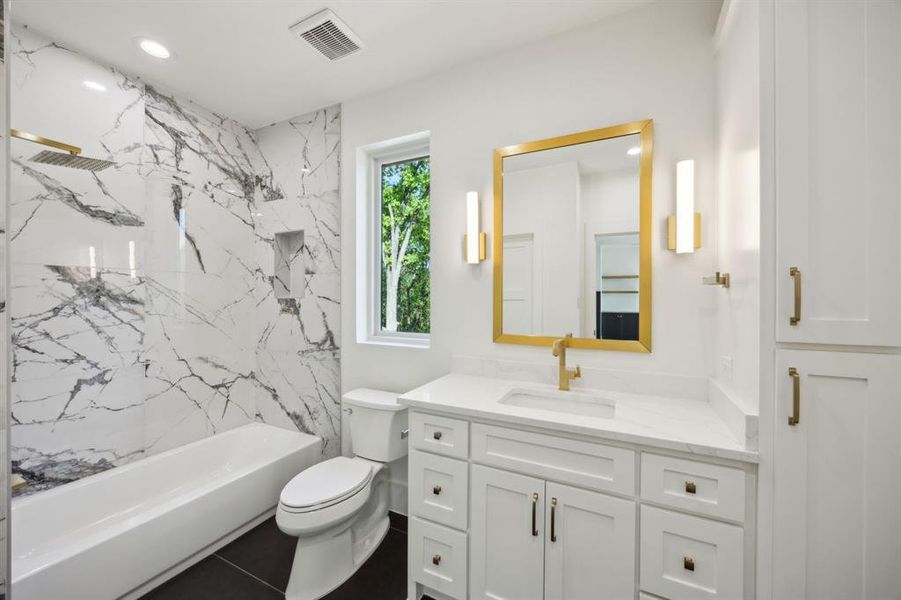 Full bath featuring vanity, recessed lighting, shower / tub combination, toilet, and visible vents Full bath featuring vanity, recessed lighting, shower / tub combination, toilet, and visible vents