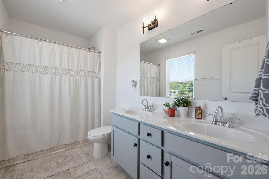 Upstairs hall bath with dual sink vanity