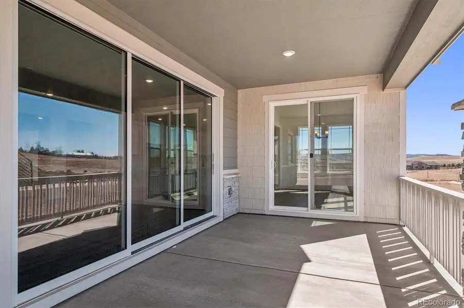 Exterior details and patio area of a home in Peakview at Ascent Village, Littleton (Image 4).